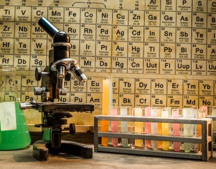 Chemistry table with test tubes and a microscope.