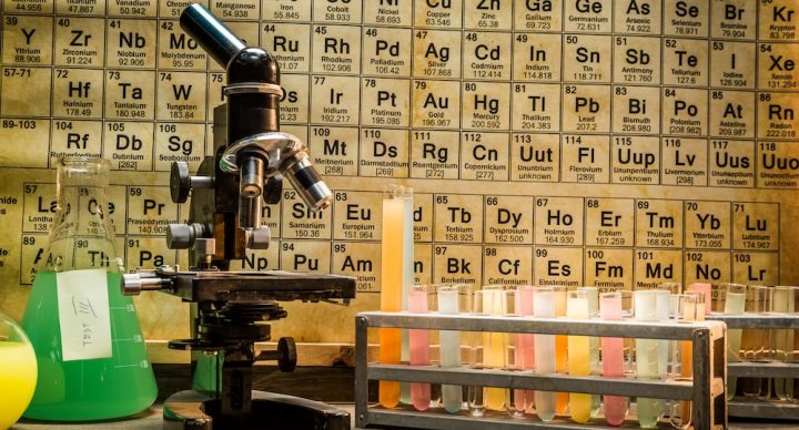 Chemistry table with test tubes and a microscope.